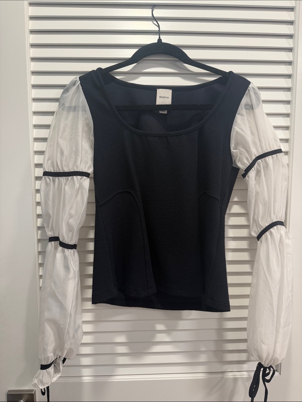 Maeve Black Top with White Puff Sleeves and Tie Cuffs